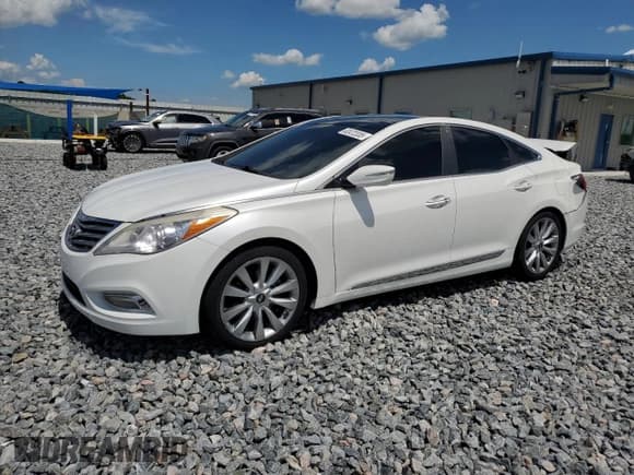 ✅ 2013 Hyundai Azera • VIN: KMHFH4JG4DA310590 • Лот: 62472335. Опубликован ранее на Copart с пробегом 75 311 миль. Бесплатный доступ к архиву аукционных продаж из США и подробный отчёт об истории автомобиля на DreamBid. Изображение 1.