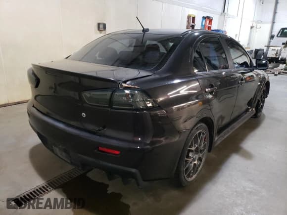 ✅ 2013 Mitsubishi Lancer Evolution MR • VIN: JA32W5FVXDU016629 • Lot: 69815625. Listed on Copart with 86,290 mi. Free auction sales archive from the USA and detailed vehicle history report at DreamBid. Image 3.
