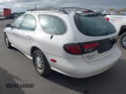 ✅ 1999 Ford Taurus SE • VIN: 1FAFP58S7XA309936 • Lot: 43703596. Wystawiony na IAAI z przebiegiem 221 934 mil. Bezpłatny archiwum sprzedaży aukcyjnych z USA i szczegółowy raport historii pojazdu na DreamBid. Zdjęcie 3.