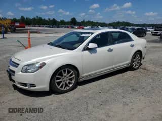 2010 Chevrolet Malibu LTZ with VIN 1G1ZE5E74AF325107, listed as a Copart auction lot 63506735 with 144,876 mi miles and Salvage title. Bid and sale history available at DreamBid. Image 1.