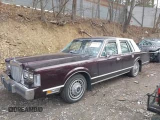✅ 1987 Lincoln Town Car • VIN: 1LNBM81F5HY704217 • Lot: 41855678. Listed on IAAI with 86,794 mi. Free auction sales archive from the USA and detailed vehicle history report at DreamBid. Image 2.