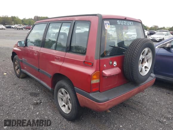 ✅ 1995 Suzuki Sidekick • VIN: JS3TD03V0S4110195 • Lot: 43259634. Listed on IAAI with 185,463 mi. Free auction sales archive from the USA and detailed vehicle history report at DreamBid. Image 3.