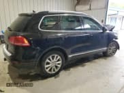 ✅ 2014 Volkswagen Touareg Sport • VIN: WVGEF9BP0ED008887 • Lot: 71643635. Listed on Copart with 233,433 mi. Free auction sales archive from the USA and detailed vehicle history report at DreamBid. Image 3.