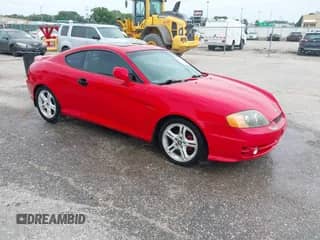 2003 Hyundai Tiburon GT with VIN KMHHN65F13U069681, listed as a IAAI auction lot 42317725 with 219,002 mi miles and . Bid and sale history available at DreamBid. Image 1.