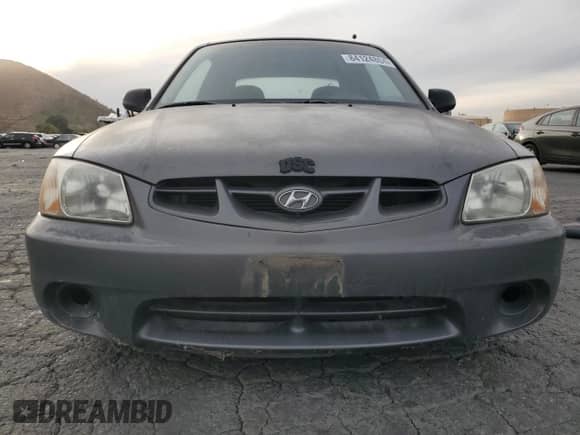 2001 Hyundai Accent GS z VIN KMHCG35C81U141661, wystawiony jako Copart lot #84124804 z przebiegiem 38 318 mil mil oraz Czysty tytuł • Clean title. Historia ofert i sprzedaży dostępna na DreamBid. Obrazek 5.