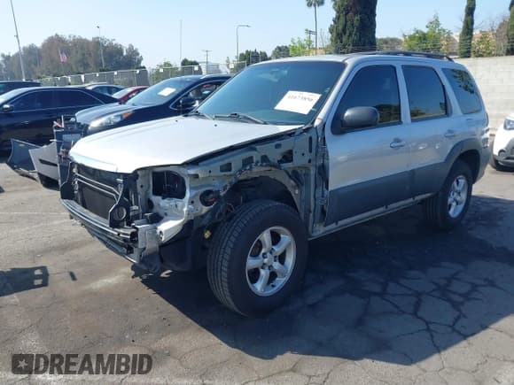 ✅ 2006 Mazda Tribute i • VIN: 4F2YZ02Z26KM38777 • Lot: 41673856. Listed on IAAI with 165,665 mi. Free auction sales archive from the USA and detailed vehicle history report at DreamBid. Image 2.