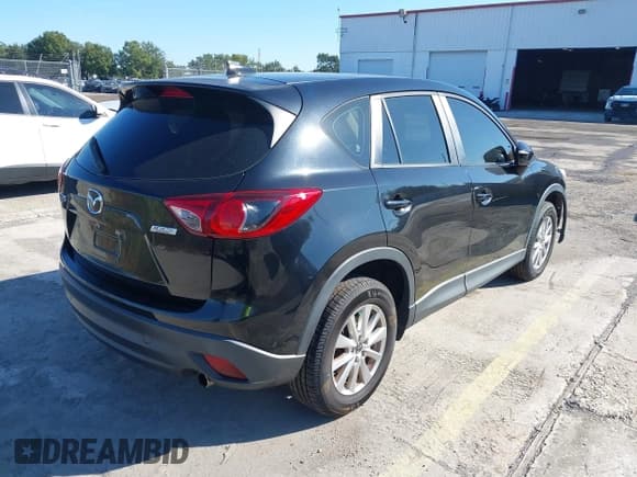 ✅ 2016 Mazda CX-5 Sport • VIN: JM3KE2BY8G0715795 • Lot: 43562802. Listed on IAAI with 129,307 mi. Free auction sales archive from the USA and detailed vehicle history report at DreamBid. Image 4.