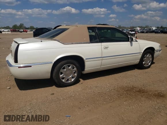 ✅ 1998 Cadillac Eldorado Touring • VIN: 1G6ET1298WU606293 • Lot: 68511745. Listed on Copart with 48,592 mi. Free auction sales archive from the USA and detailed vehicle history report at DreamBid. Image 3.