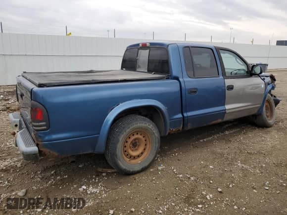 2002 Dodge Dakota Sport z VIN 1B7HL38X62S686016, wystawiony jako Copart lot #52917944 z przebiegiem 268 964 mil mil oraz Szkoda całkowita • Salvage title. Historia ofert i sprzedaży dostępna na DreamBid. Obrazek 3.
