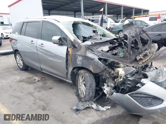 ✅ 2012 Mazda 5 Sport • VIN: JM1CW2BL4C0133346 • Lot: 43427622. Listed on IAAI with 89,283 mi. Free auction sales archive from the USA and detailed vehicle history report at DreamBid. Image 1.