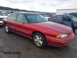 ✅ 1997 Pontiac Bonneville SE • VIN: 1G2HX52K0VH261054 • Lot: 43826174. Listed on IAAI with 148,296 mi. Free auction sales archive from the USA and detailed vehicle history report at DreamBid. Image 1.