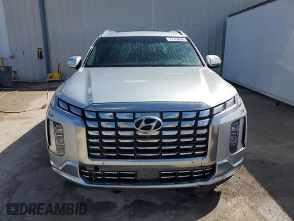 2023 Hyundai Palisade Calligraphy с VIN KM8R74GE4PU597177, выставлен на аукционе Copart как лот 77450264 с пробегом 21 616 миль миль и Списание • Salvage title. История ставок и продаж доступна на DreamBid. Изображение 5.