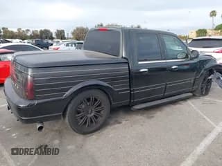 ✅ 2002 Lincoln Blackwood • VIN: 5LTEW05A52KJ02615 • Лот: 42136233. Опубликован ранее на IAAI с пробегом 274 249 миль. Бесплатный доступ к архиву аукционных продаж из США и подробный отчёт об истории автомобиля на DreamBid. Изображение 4.