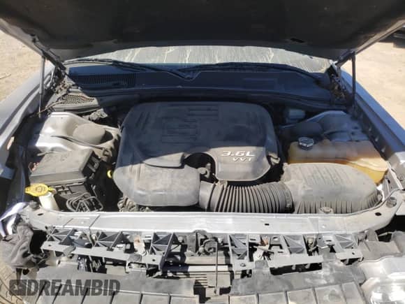 2013 Dodge Challenger SXT z VIN 2C3CDYAGXDH612465, wystawiony jako Copart lot #70135804 z przebiegiem 116 793 mil mil oraz Szkoda całkowita • Salvage title. Historia ofert i sprzedaży dostępna na DreamBid. Obrazek 12.