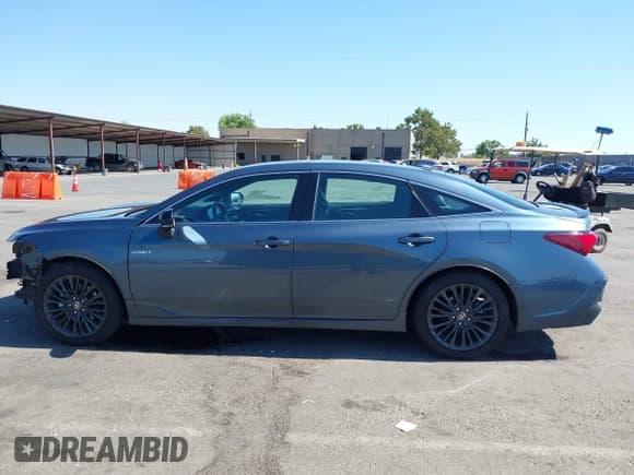 ✅ 2021 Toyota Avalon Hybrid XSE • VIN: 4T1EA1AB8MU007345 • Lot: 42674139. Wystawiony na IAAI z przebiegiem 58 296 mil. Bezpłatny archiwum sprzedaży aukcyjnych z USA i szczegółowy raport historii pojazdu na DreamBid. Zdjęcie 14.