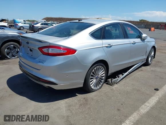 ✅ 2013 Ford Fusion Titanium Hybrid • VIN: 3FA6P0RUXDR388796 • Lot: 42840013. Listed on IAAI with Not provided. Free auction sales archive from the USA and detailed vehicle history report at DreamBid. Image 4.