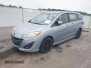 ✅ 2012 Mazda 5 Touring • VIN: JM1CW2CL7C0115096 • Lot: 42524956. Wystawiony na IAAI z przebiegiem 173 155 mil. Bezpłatny archiwum sprzedaży aukcyjnych z USA i szczegółowy raport historii pojazdu na DreamBid. Zdjęcie 2.