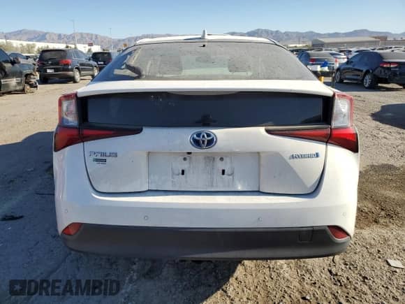 2021 Toyota Prius L Eco с VIN JTDKAMFU6M3142123, выставлен на аукционе Copart как лот 55076445 с пробегом 68 256 миль миль и Списание • Salvage title. История ставок и продаж доступна на DreamBid. Изображение 6.