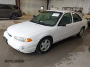 ✅ 1997 Ford Contour LX • VIN: 1FALP6537VK132379 • Lot: 42771426. Listed on IAAI with 122,263 mi. Free auction sales archive from the USA and detailed vehicle history report at DreamBid. Image 2.