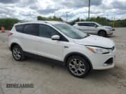 ✅ 2016 Ford Escape Titanium • VIN: 1FMCU0J9XGUA14646 • Lot: 70089815. Listed on Copart with 168,784 mi. Free auction sales archive from the USA and detailed vehicle history report at DreamBid. Image 4.