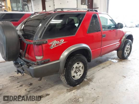 2004 Chevrolet Blazer LS with VIN 1GNCT18X74K121475, listed as a IAAI auction lot 41770798 with 168,634 mi miles and . Bid and sale history available at DreamBid. Image 4.