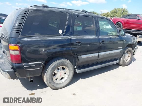 ✅ 2001 GMC Yukon SLE • VIN: 1GKEC13T21J134663 • Lot: 43312347. Listed on IAAI with 322,513 mi. Free auction sales archive from the USA and detailed vehicle history report at DreamBid. Image 4.