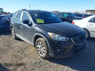✅ 2016 Mazda CX-5 Touring • VIN: JM3KE2CY3G0828116 • Lot: 43545320. Listed on IAAI with 109,581 mi. Free auction sales archive from the USA and detailed vehicle history report at DreamBid. Image 1.