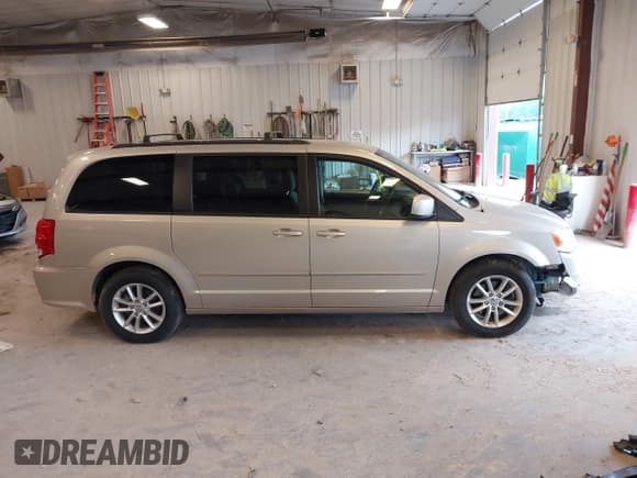 ✅ 2014 Dodge Grand Caravan SXT • VIN: 2C4RDGCG2ER105598 • Lot: 42648383. Listed on IAAI with 103,238 mi. Free auction sales archive from the USA and detailed vehicle history report at DreamBid. Image 13.