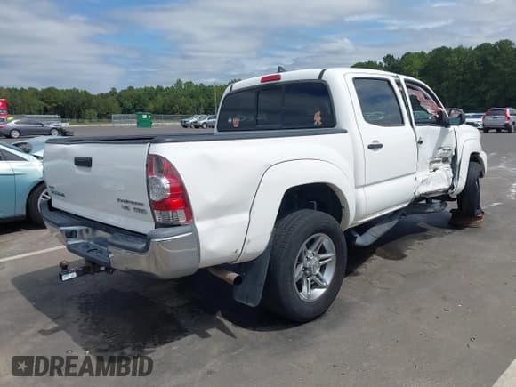 ✅ 2014 Toyota Tacoma PreRunner • VIN: 3TMJU4GN5EM161224 • Lot: 43179702. Listed on IAAI with 148,222 mi. Free auction sales archive from the USA and detailed vehicle history report at DreamBid. Image 4.