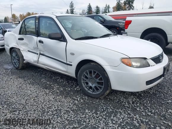 ✅ 2003 Mazda Protege DX • VIN: JM1BJ225331141069 • Лот: 43688727. Опубликован ранее на IAAI с пробегом 136 202 миль. Бесплатный доступ к архиву аукционных продаж из США и подробный отчёт об истории автомобиля на DreamBid. Изображение 1.