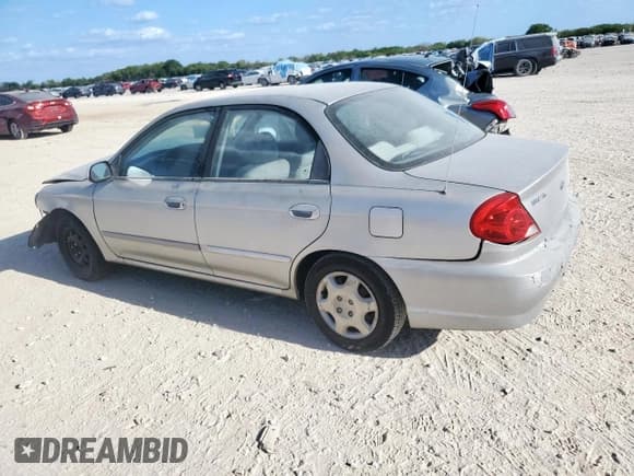 ✅ 2003 Kia Spectra • VIN: KNAFB121X35230410 • Lot: 70925065. Listed on Copart with 135,766 mi. Free auction sales archive from the USA and detailed vehicle history report at DreamBid. Image 2.