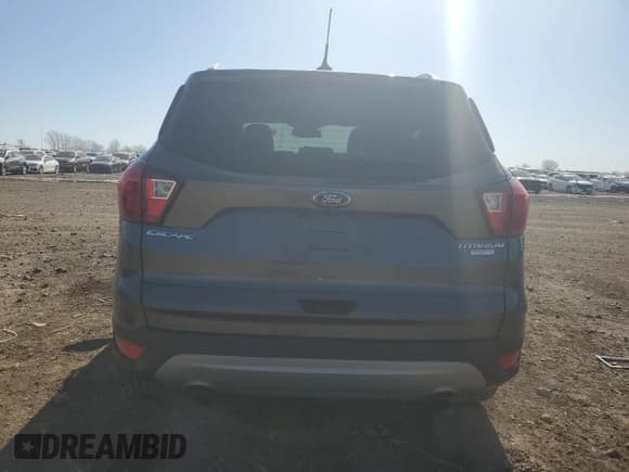 ✅ 2019 Ford Escape Titanium • VIN: 1FMCU0J99KUA91761 • Лот: 51874095. Опубликован ранее на Copart с пробегом 98 211 миль. Бесплатный доступ к архиву аукционных продаж из США и подробный отчёт об истории автомобиля на DreamBid. Изображение 6.