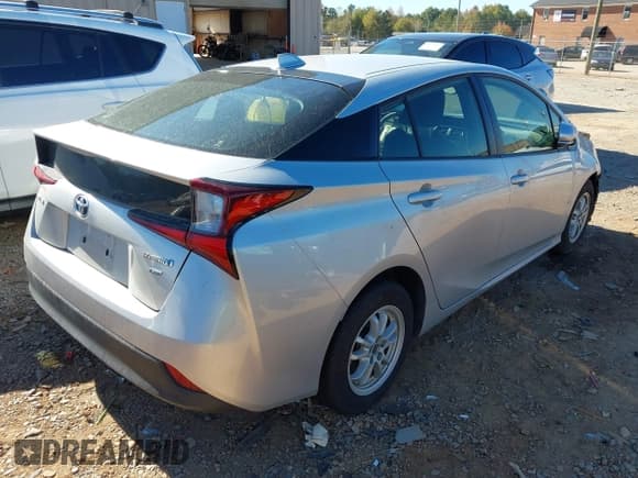 ✅ 2021 Toyota Prius L Eco • VIN: JTDKAMFU9M3143122 • Lot: 43486623. Listed on IAAI with 81,483 mi. Free auction sales archive from the USA and detailed vehicle history report at DreamBid. Image 4.