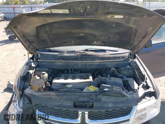 2015 Dodge Journey American Value z VIN 3C4PDCAB7FT559299, wystawiony jako IAAI lot #43409195 z przebiegiem 183 905 mil mil oraz . Historia ofert i sprzedaży dostępna na DreamBid. Obrazek 10.