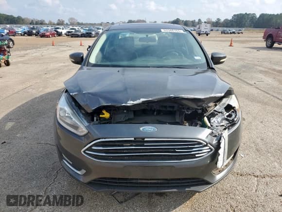 ✅ 2018 Ford Focus Titanium • VIN: 1FADP3J24JL277660 • Лот: 93348165. Опубликован ранее на Copart с пробегом 74 235 миль. Бесплатный доступ к архиву аукционных продаж из США и подробный отчёт об истории автомобиля на DreamBid. Изображение 5.