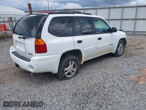 ✅ 2004 GMC Envoy SLE • VIN: 1GKDS13SX42446766 • Lot: 42975572. Listed on IAAI with 129,737 mi. Free auction sales archive from the USA and detailed vehicle history report at DreamBid. Image 4.