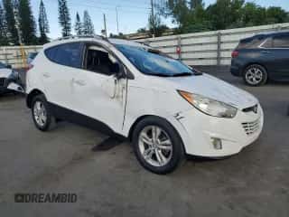 2013 Hyundai Tucson GLS with VIN KM8JU3AC6DU757207, listed as a Copart auction lot 89450945 with 164,630 mi miles and Salvage title. Bid and sale history available at DreamBid. Image 4.