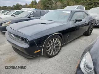 ✅ 2013 Dodge Challenger R/T Classic • VIN: 2C3CDYBT3DH665987 • Lot: 92890005. Wystawiony na Copart z przebiegiem 154 045 mil. Bezpłatny archiwum sprzedaży aukcyjnych z USA i szczegółowy raport historii pojazdu na DreamBid. Zdjęcie 1.