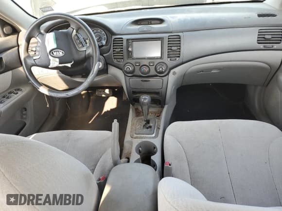 ✅ 2007 Kia Optima LX • VIN: KNAGE123575131092 • Лот: 62549774. Опубликован ранее на Copart с пробегом Не указан. Бесплатный доступ к архиву аукционных продаж из США и подробный отчёт об истории автомобиля на DreamBid. Изображение 8.