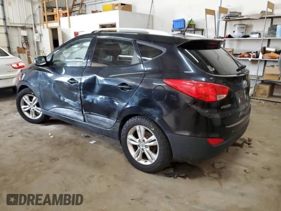 2011 Hyundai Tucson GLS z VIN KM8JUCACXBU307959, wystawiony jako Copart lot #67553525 z przebiegiem 171 724 mil mil oraz Nie do naprawy • Non repairable. Historia ofert i sprzedaży dostępna na DreamBid. Obrazek 2.