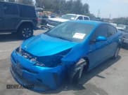 ✅ 2021 Toyota Prius L Eco • VIN: JTDKAMFUXM3134462 • Lot: 42450931. Listed on IAAI with 89,239 mi. Free auction sales archive from the USA and detailed vehicle history report at DreamBid. Image 2.