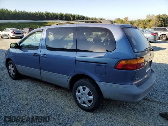 ✅ 1999 Toyota Sienna LE • VIN: 4T3ZF13C8XU108650 • Lot: 74476004. Listed on Copart with 215,060 mi. Free auction sales archive from the USA and detailed vehicle history report at DreamBid. Image 2.
