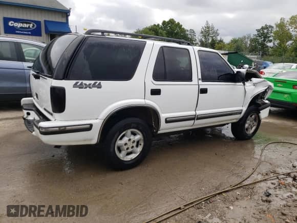 1999 Chevrolet Blazer LS z VIN 1GNDT13W9X2166733, wystawiony jako Copart lot #64965434 z przebiegiem 214 296 mil mil oraz Nie do naprawy • Non repairable. Historia ofert i sprzedaży dostępna na DreamBid. Obrazek 3.