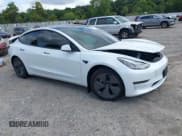 ✅ 2021 Tesla Model 3 Standard Range Plus • VIN: 5YJ3E1EA6MF052276 • Lot: 43164101. Listed on IAAI with 26,101 mi. Free auction sales archive from the USA and detailed vehicle history report at DreamBid. Image 1.