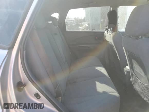 2005 Hyundai Tucson GL z VIN KM8JM12B95U067091, wystawiony jako Copart lot #79297524 z przebiegiem Nie podano mil oraz Szkoda całkowita • Salvage title. Historia ofert i sprzedaży dostępna na DreamBid. Obrazek 11.