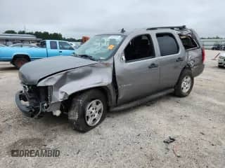 2007 Chevrolet Tahoe LS z VIN 1GNFC13J97J126459, wystawiony jako Copart lot #64099995 z przebiegiem 220 249 mil mil oraz Szkoda całkowita • Salvage title. Historia ofert i sprzedaży dostępna na DreamBid. Obrazek 1.
