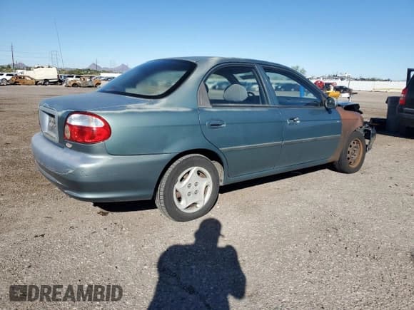 ✅ 2000 Kia Sephia • VIN: KNAFB1211Y5836265 • Lot: 86290735. Listed on Copart with 46,439 mi. Free auction sales archive from the USA and detailed vehicle history report at DreamBid. Image 3.
