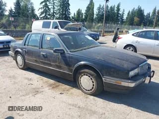 ✅ 1990 Cadillac Seville • VIN: 1G6KY5337LU818314 • Lot: 42807836. Wystawiony na IAAI z przebiegiem 162 743 mil. Bezpłatny archiwum sprzedaży aukcyjnych z USA i szczegółowy raport historii pojazdu na DreamBid. Zdjęcie 1.