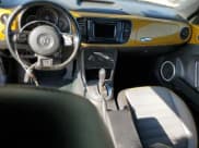 ✅ 2016 Volkswagen Beetle Dune • VIN: 3VWS17AT8GM621269 • Lot: 47991993. Listed on Copart with 51,741 mi. Free auction sales archive from the USA and detailed vehicle history report at DreamBid. Image 8.