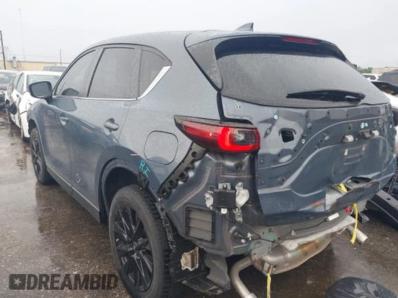 ✅ 2023 Mazda CX-5 S Carbon Edition • VIN: JM3KFBCM7P0104374 • Лот: 42329421. Опубликован ранее на IAAI с пробегом 27 575 миль. Бесплатный доступ к архиву аукционных продаж из США и подробный отчёт об истории автомобиля на DreamBid. Изображение 3.